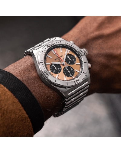 Montre Breitling Chronomat B01 automatique cadran en cuivre bracelet acier rouleau 42 mm