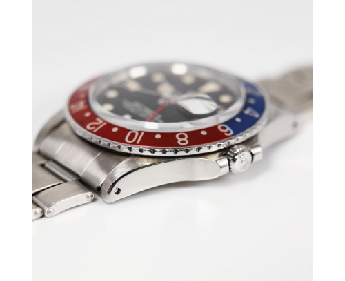 Montre Rolex GMT Master Long automatique acier lunette bleue et rouge cadran noir bracelet acier 40 mm